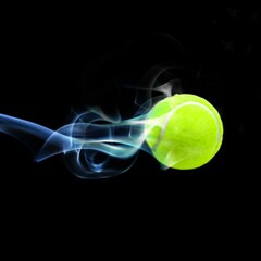 Close up of tennis ball with smoke
