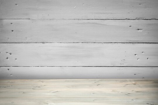 Fototapeta Minimalist illustration is showing wooden tabletop with painted plank wall and wood grain texture