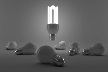 Graphic image of lit energy efficient lightbulb over bulbs