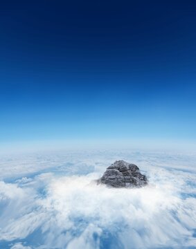 Fototapeta Mountain peak through the clouds