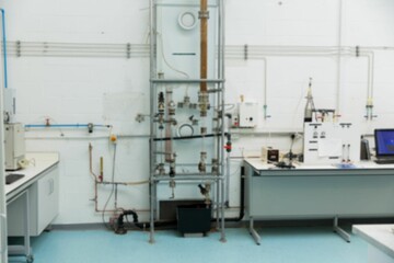Central metal pipe assembly is standing in flat design lab, featuring valves and control panel