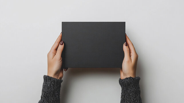man holding blank blackboard