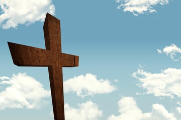 Weathered wooden cross is standing in flat design against pale blue sky dotted with fluffy clouds
