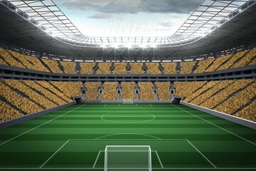 Vast football stadium with fans in yellow