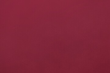 Flat design is showing solid maroon surface filling entire frame in minimal abstract style