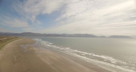 Sea coastline against cloudy sky