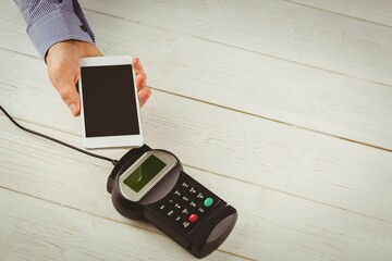 Man using smartphone to express pay