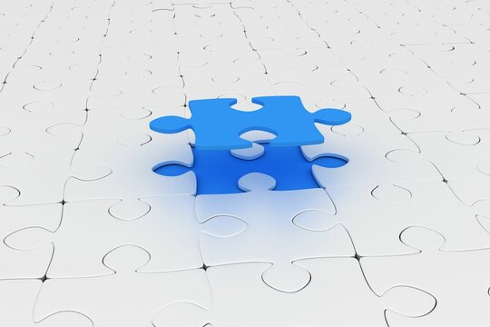 Blue jigsaw piece over jigsaw puzzle
