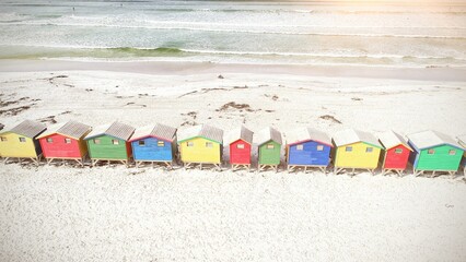 Colorful wooden houses on sand