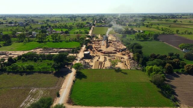 Aerial view of rural landscape with brick kiln and fields, Pakistan.