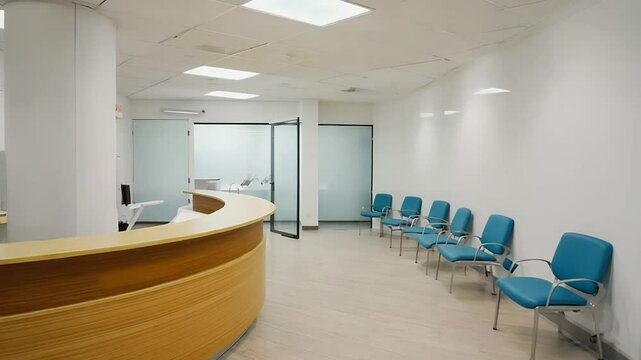 Modern waiting room with empty chairs and reception desk