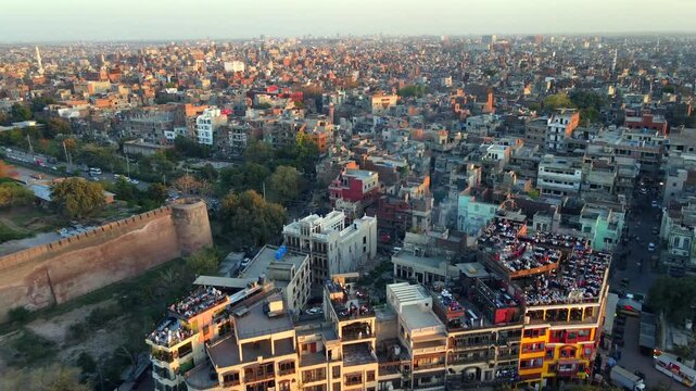 Aerial view of urban skyline and greenery, Pakistan.