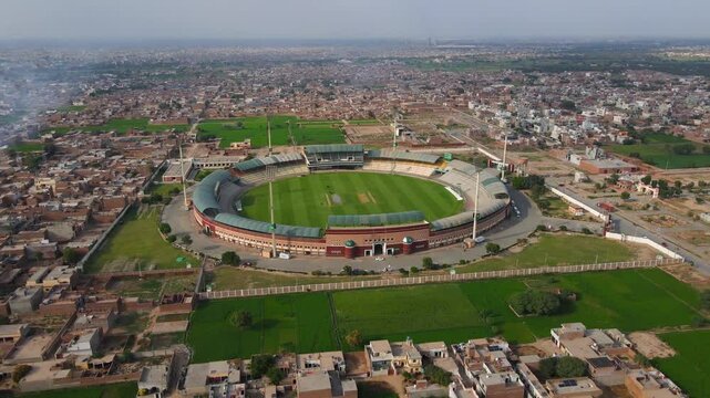 Aerial view of stadium and urban landscape, Pakistan.