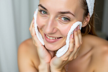 A woman with a towel wrapped around her face.