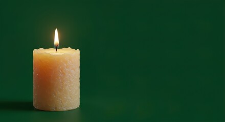 Candles burning peacefully on a green background for holiday and romantic decoration