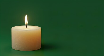 Burning Candle on Green Background