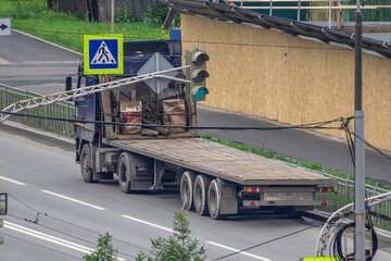 The truck is parked at a construction site on a summer day