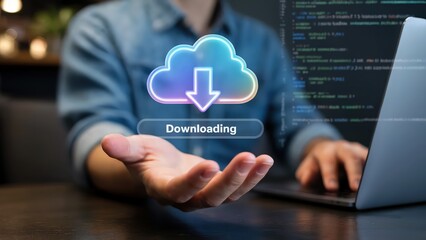 Cloud computing with hand holding a data download icon near a laptop