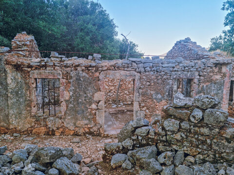 Traditional houses in ruins in Old Vlachata(Palia Vlachata), abandonned village after a devastating earthquake, hidden gem near Sami in Kefalonia island, Greece