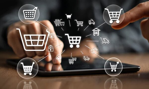 Hands interacting with a digital tablet displaying various shopping icons - Powered by Adobe