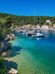 Panoramic view to Kioni village with crystal blue waters, boats and traditional houses, Kioni,...