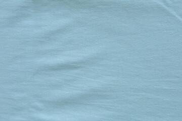 Background texture of fabric cotton light green color. Copy space for your text and design. Textile concept and soft backdrop.