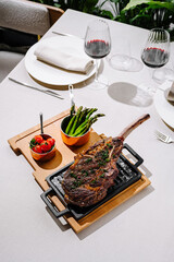 Delicious grilled steak served on a sizzling platter with vegetables