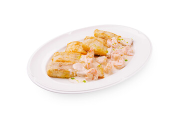 Shrimp with creamy sauce served with fried plantains in a restaurant