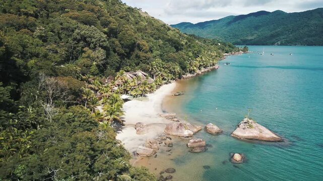 Aerial view of the tropical sea and sandy beach in the calm bay near the town of Paraty in Brazil