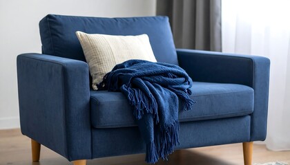 Cozy navy armchair with throw