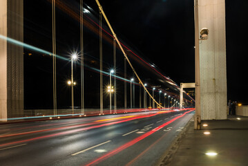 View of vibrant light streaks painting the Elisabeth Bridge at night, illuminating the dark sky in Budapest, Central Hungary, Hungary.