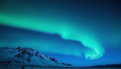 Naklejka premium Curving aurora borealis over snow-capped mountains