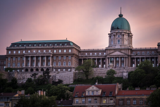 View of grand architecture, with a stately dome and rows of symmetrical columns under a sky tinged with soft hues, Budapest, Central Hungary, Hungary.