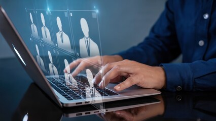Online recruitment with candidate profiles displayed on a laptop screen.