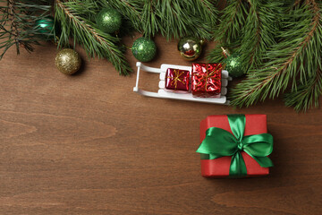Gift boxes, New Year toys, New Year tree on wooden background