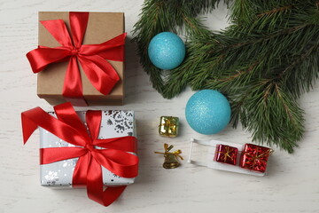 Gift boxes, New Year toys, New Year tree on white wood