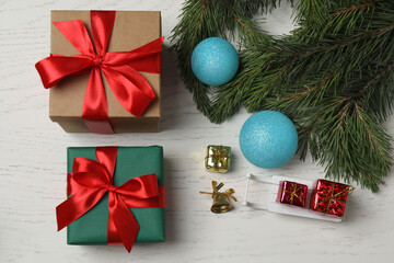 Gift boxes, New Year toys, New Year tree on white wood