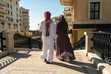 Qanat Quartier in the Pearl-Qatar, Persian Gulf, Middle East, Persian Gulf. Sunny day with blue sky. tourists walk along a crowded strip of beautiful multi-colored houses 