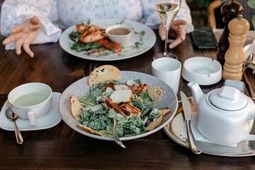 Chicken salad and tea on rustic table