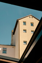 Minimalist building corner warm tones clear sky