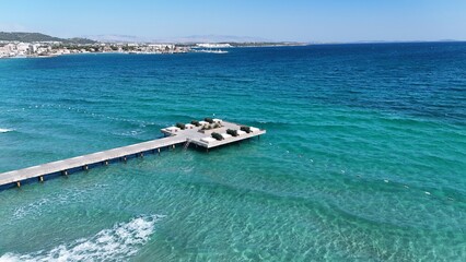 Aerial view of a scenic pier stretching into the turquoise sea