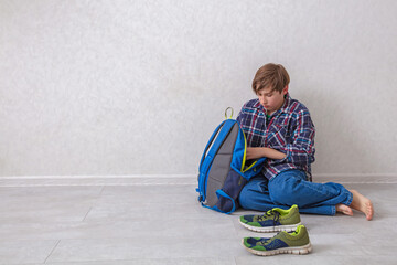 Young boy sitting on the floor