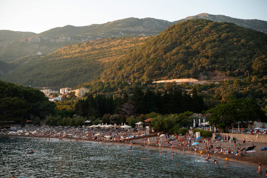 Scenic Beach with Lush Hills and Clear Sea