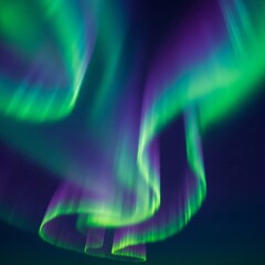 Vibrant Aurora Borealis in Green and Purple
