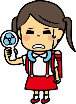 ハンディ扇風機で涼む小学生女児