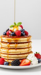 Delicious Pancake Stack with Berries, Whipped Cream, Maple Syrup