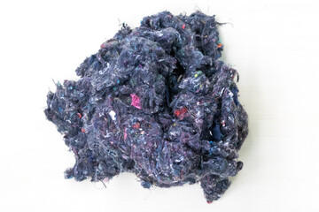 Sustainable recycled textile fibers derived from old garment cotton. This eco-friendly fabric transforms into soft pillows, cozy cushions, toys, and various new products.