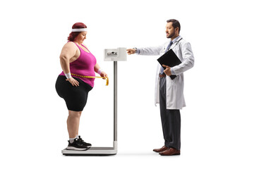 Male doctor checking weight of a corpulent woman
