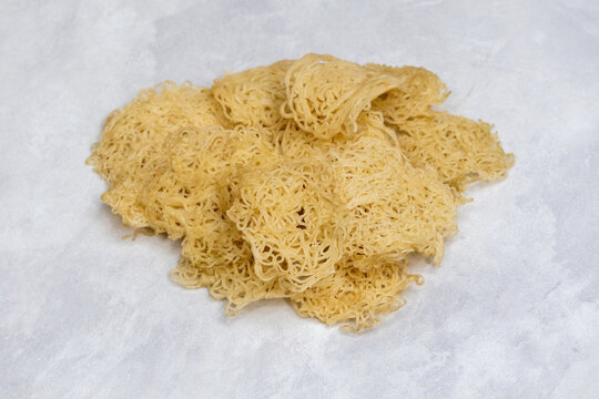 Deliciously crispy Siris Pitha, a traditional Bangladeshi rice flour cake. Popular as Syringe Pitha or Phul Pitha, this Bengali food offers a unique and delightful texture.