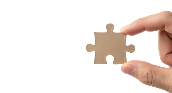 Hand Holding Beige Jigsaw Puzzle Piece